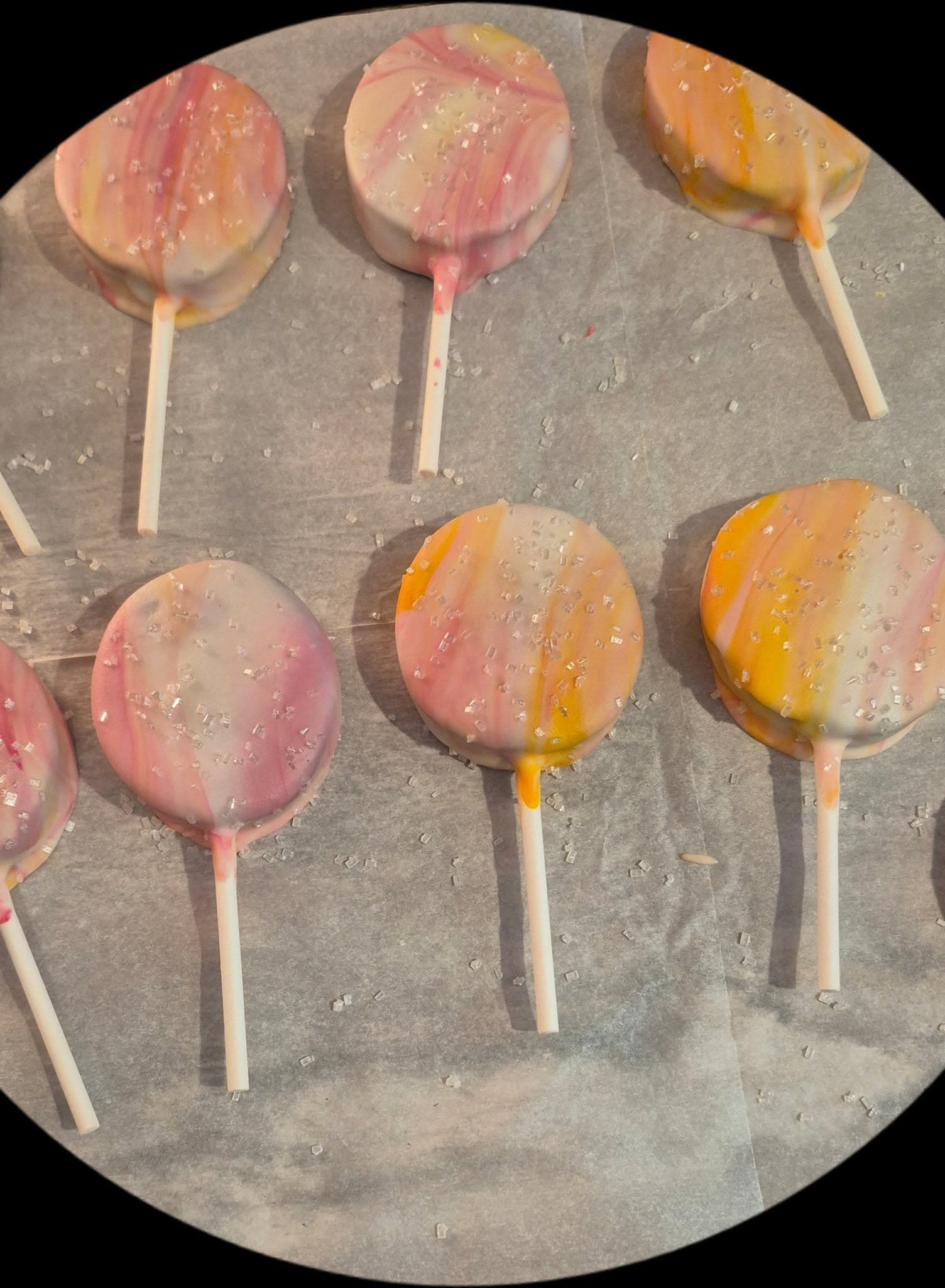 Watercolor lollipops with pink and orange gradients and sparkle