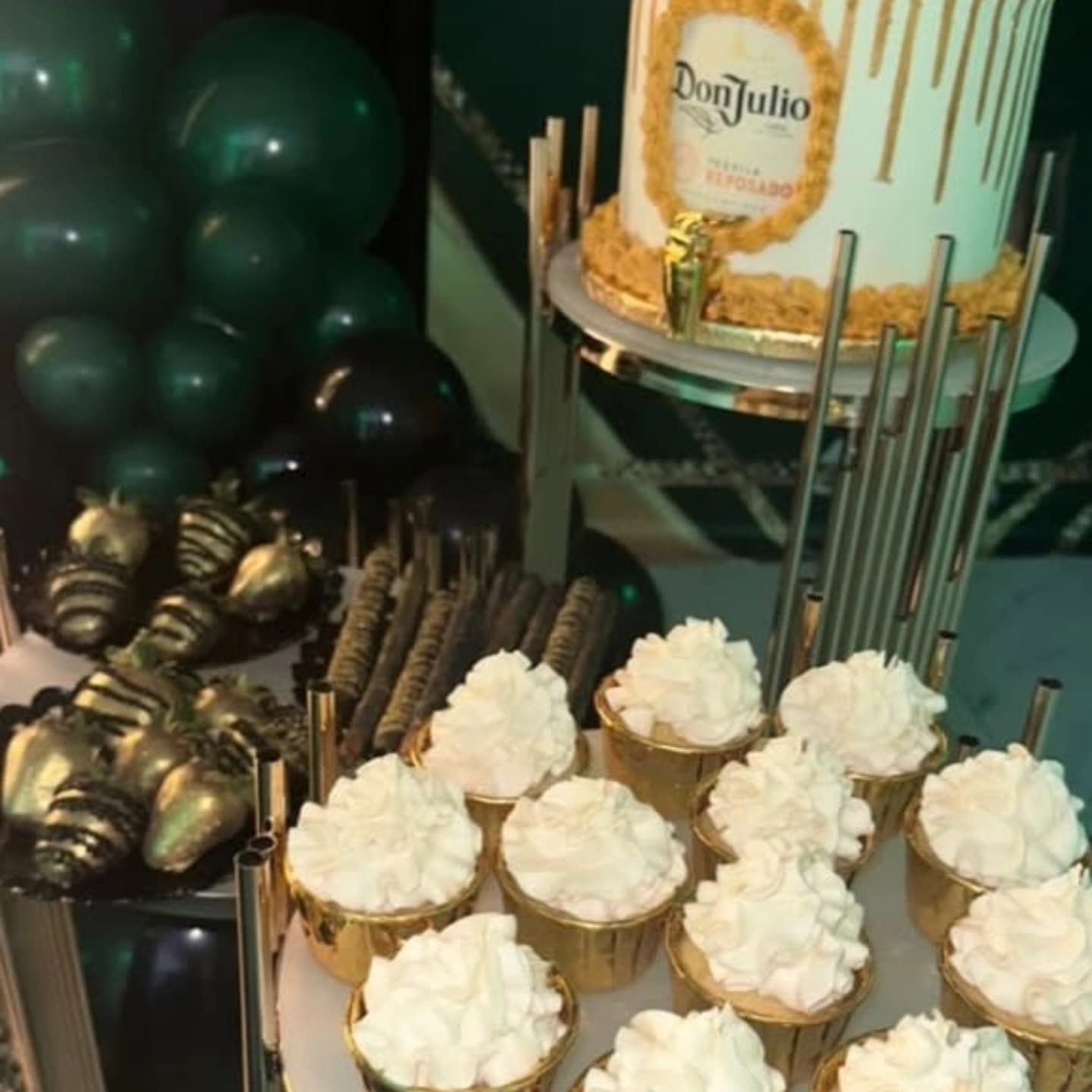 White frosted cupcakes with whipped cream topping